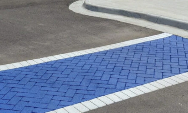 Blue and white Street Bond Coating applied to a walkway